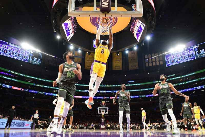 LOS ANGELES, CA - APRIL 11: LeBron James #6 of the Los Angeles Lakers dunks the ball during the game against the Minnesota Timberwolves during the 2023 Play-In Tournament on April 11, 2023 at Crypto.Com Arena in Los Angeles, California. NOTE TO USER: User expressly acknowledges and agrees that, by downloading and/or using this Photograph, user is consenting to the terms and conditions of the Getty Images License Agreement. Mandatory Copyright Notice: Copyright 2023 NBAE (Photo by Adam Pantozzi/NBAE via Getty Images)