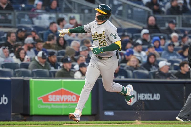 Apr 25, 2024; Bronx, New York, USA; Oakland Athletics left fielder Tyler Nevin (26) runs the bases after his two run home run during the third inning against the New York Yankees at Yankee Stadium. Mandatory Credit: Vincent Carchietta-USA TODAY Sports