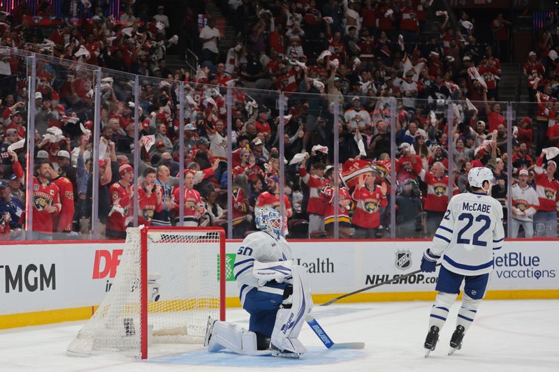 May 9, 2025; Sunrise, Florida, USA; Toronto Maple Leafs goaltender Joseph Woll (60) and defenseman Jake McCabe (22) look on after. Goal by Florida Panthers center Sam Reinhart (not pictured) during the second period in game three of the second round of the 2025 Stanley Cup Playoffs at Amerant Bank Arena. Mandatory Credit: Sam Navarro-Imagn Images