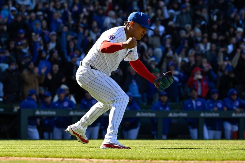 Apr 5, 2024; Chicago, Illinois, USA;  Chicago Cubs pitcher Adbert Alzolay (73) reacts after defeating the Los Angeles Dodgers at Wrigley Field. Mandatory Credit: Matt Marton-USA TODAY Sports