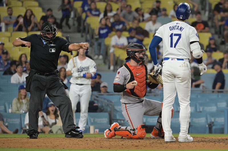 Jul 24, 2024; Los Angeles, California, USA;   Los Angeles Dodgers designated hitter Shohei Ohtani (17) is called out on strikes in the eighth inning against the San Francisco Giants Dodger Stadium. Mandatory Credit: Jayne Kamin-Oncea-USA TODAY Sports