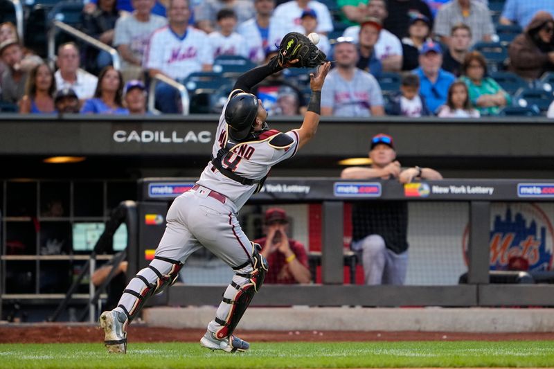 Sep 14, 2023; New York City, New York, USA; Arizona Diamondbacks catcher Gabriel Moreno (14) catches a foul ball hit by New York Mets right Fielder DJ Steward (not pictured) during the eighth inning at Citi Field. Mandatory Credit: Gregory Fisher-USA TODAY Sports