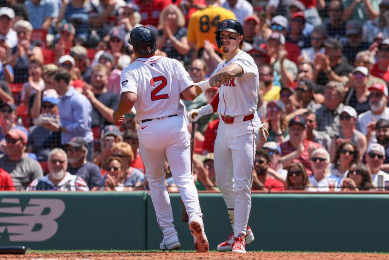 Jun 5, 2024; Boston, Massachusetts, USA; Boston Red Sox first baseman Dominic Smith (2) high fives Boston Red Sox left fielder Jarren Duran (16) after scoring during the second inning against the Atlanta Braves at Fenway Park. Mandatory Credit: Paul Rutherford-USA TODAY Sports