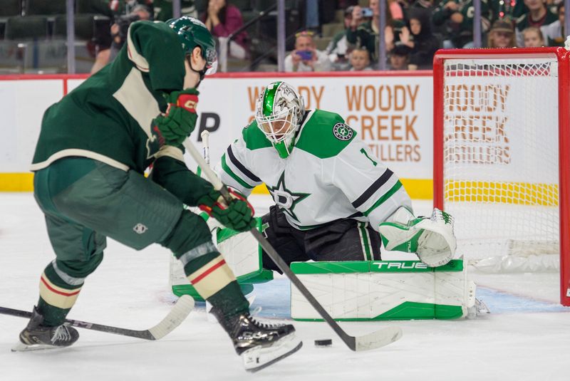 Sep 25, 2025; Saint Paul, Minnesota, USA; Minnesota Wild left wing Liam Ohgren (28) sets up a backhand shot against Dallas Stars goaltender Casey DeSmith (1) in the third period at Grand Casino Arena. Mandatory Credit: Matt Blewett-Imagn Images