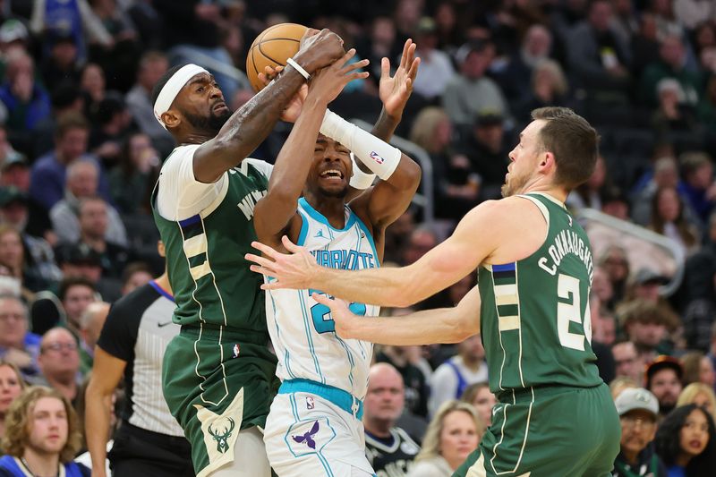 MILWAUKEE, WISCONSIN - FEBRUARY 09: Brandon Miller #24 of the Charlotte Hornets is fouled by Bobby Portis #9 of the Milwaukee Bucks during the first half of a game at Fiserv Forum on February 09, 2024 in Milwaukee, Wisconsin. NOTE TO USER: User expressly acknowledges and agrees that, by downloading and or using this photograph, User is consenting to the terms and conditions of the Getty Images License Agreement. (Photo by Stacy Revere/Getty Images)