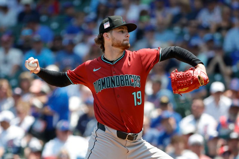 Jul 19, 2024; Chicago, Illinois, USA; Arizona Diamondbacks starting pitcher Ryne Nelson (19) delivers a pitch against the Chicago Cubs during the first inning at Wrigley Field. Mandatory Credit: Kamil Krzaczynski-USA TODAY Sports