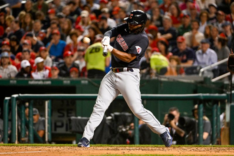 Apr 14, 2023; Washington, District of Columbia, USA; Cleveland Guardians designated hitter Josh Bell (55) hits a double against the Washington Nationals during the eighth inning at Nationals Park. Mandatory Credit: Brad Mills-USA TODAY Sports