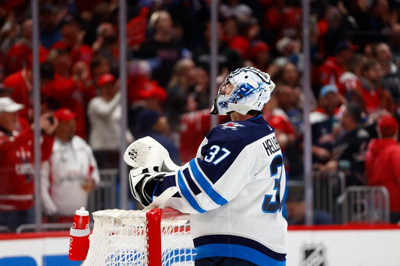 Mar 24, 2024; Washington, District of Columbia, USA; Winnipeg Jets goaltender Connor Hellebuyck (37) looks on after allowing a goal by the Washington Capitals during the third period at Capital One Arena. Mandatory Credit: Amber Searls-USA TODAY Sports