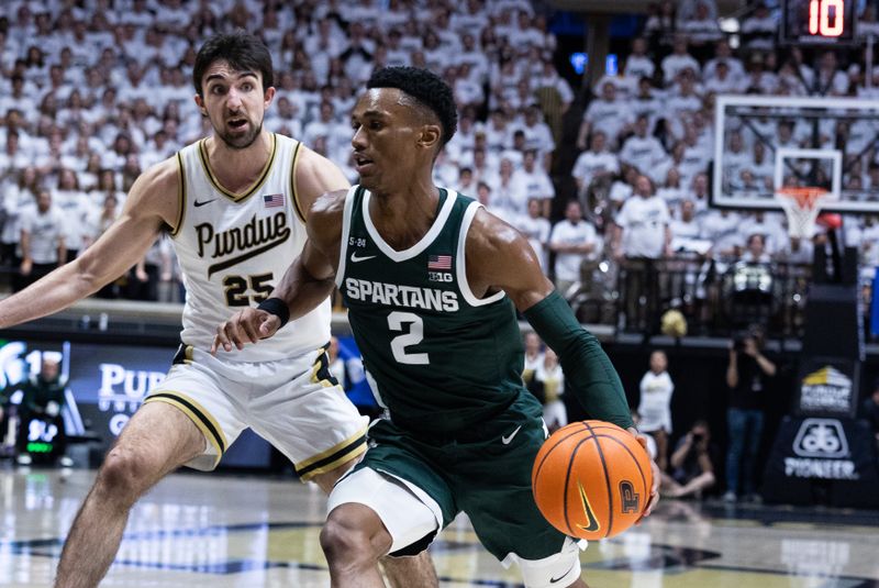 Jan 29, 2023; West Lafayette, Indiana, USA;  Michigan State Spartans guard Tyson Walker (2) dribbles the ball while Purdue Boilermakers guard Ethan Morton (25) defends in the first half at Mackey Arena. Mandatory Credit: Trevor Ruszkowski-USA TODAY Sports