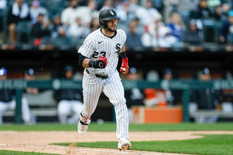 May 24, 2025; Chicago, Illinois, USA; Chicago White Sox designated hitter Andrew Benintendi (23) runs after hitting a two-run double against the Texas Rangers during the sixth inning at Rate Field. Mandatory Credit: Kamil Krzaczynski-Imagn Images