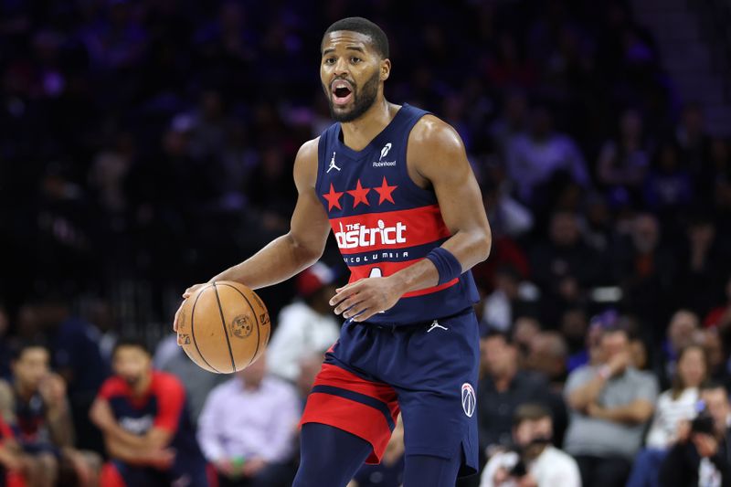 PHILADELPHIA, PENNSYLVANIA - JANUARY 08: Jared Butler #4 of the Washington Wizards dribbles the ball during a game against the Philadelphia 76ers at the Wells Fargo Center on January 08, 2025 in Philadelphia, Pennsylvania. NOTE TO USER: User expressly acknowledges and agrees that, by downloading and or using this photograph, User is consenting to the terms and conditions of the Getty Images License Agreement. (Photo by Emilee Chinn/Getty Images)