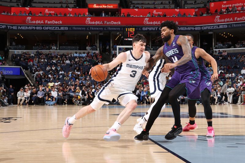 MEMPHIS, TN - MARCH 13: Jake LaRavia #3 of the Memphis Grizzlies drives to the basket during the game against the Charlotte Hornets on March 13, 2024 at FedExForum in Memphis, Tennessee. NOTE TO USER: User expressly acknowledges and agrees that, by downloading and or using this photograph, User is consenting to the terms and conditions of the Getty Images License Agreement. Mandatory Copyright Notice: Copyright 2024 NBAE (Photo by Joe Murphy/NBAE via Getty Images)