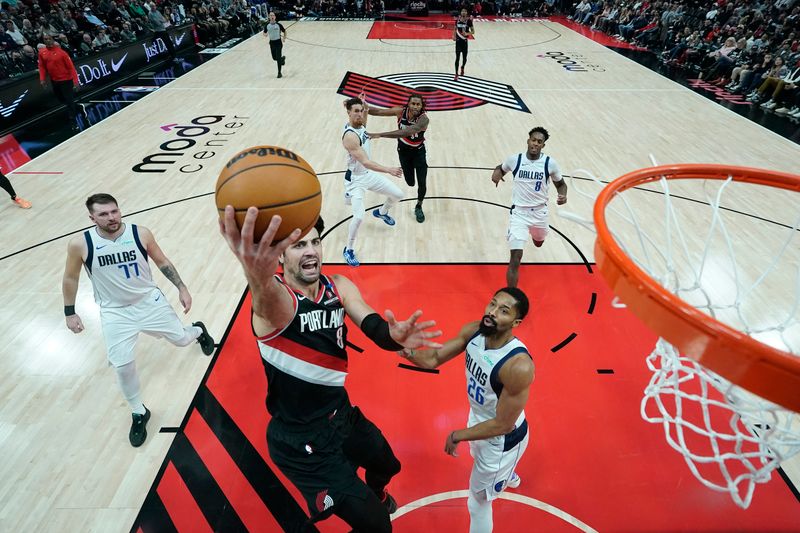 PORTLAND, OREGON - DECEMBER 01: Deni Avdija #8 of the Portland Trail Blazers shoots the ball past Spencer Dinwiddie #26 of the Dallas Mavericks during the second half at Moda Center on December 01, 2024 in Portland, Oregon. NOTE TO USER: User expressly acknowledges and agrees that, by downloading and or using this photograph, User is consenting to the terms and conditions of the Getty Images License Agreement. (Photo by Soobum Im/Getty Images)