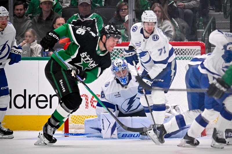 Jan 18, 2026; Dallas, Texas, USA; Tampa Bay Lightning goaltender Andrei Vasilevskiy (88) and Dallas Stars right wing Mikko Rantanen (96) look for the puck during the third period at the American Airlines Center. Mandatory Credit: Jerome Miron-Imagn Images