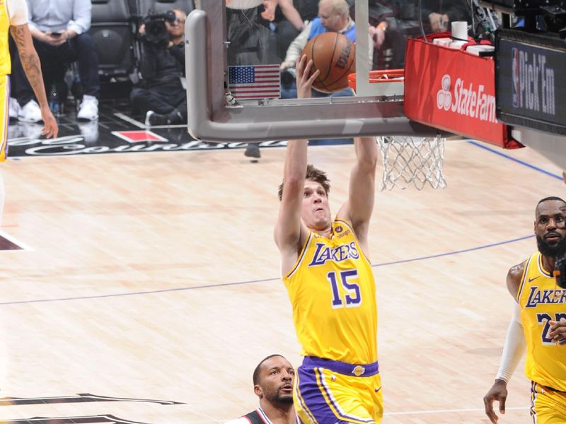 LOS ANGELES, CA - FEBRUARY 28: Austin Reaves #15 of the Los Angeles Lakers dunks the ball during the game against the LA Clippers on February 28, 2024 at Crypto.Com Arena in Los Angeles, California. NOTE TO USER: User expressly acknowledges and agrees that, by downloading and/or using this Photograph, user is consenting to the terms and conditions of the Getty Images License Agreement. Mandatory Copyright Notice: Copyright 2024 NBAE (Photo by Andrew D. Bernstein/NBAE via Getty Images)