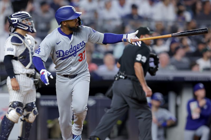 Jun 9, 2024; Bronx, New York, USA; Los Angeles Dodgers left fielder Teoscar Hernandez (37) watches his solo home run against the New York Yankees during the sixth inning at Yankee Stadium. Mandatory Credit: Brad Penner-USA TODAY Sports