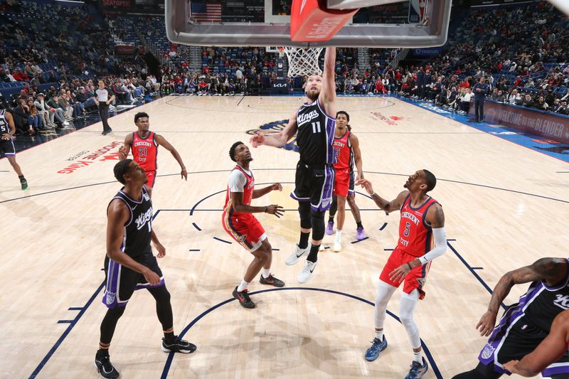 NEW ORLEANS, LA - DECEMBER 12: Domantas Sabonis #11 of the Sacramento Kings drives to the basket during the game against the New Orleans Pelicans on December 12, 2024 at the Smoothie King Center in New Orleans, Louisiana. NOTE TO USER: User expressly acknowledges and agrees that, by downloading and or using this Photograph, user is consenting to the terms and conditions of the Getty Images License Agreement. Mandatory Copyright Notice: Copyright 2024 NBAE (Photo by Layne Murdoch Jr./NBAE via Getty Images)