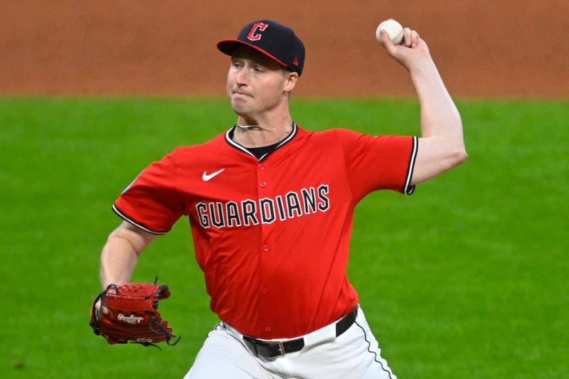 Apr 22, 2025; Cleveland, Ohio, USA; Cleveland Guardians relief pitcher Tim Herrin (29) delivers a pitch in the seventh inning against the New York Yankees at Progressive Field. Mandatory Credit: David Richard-Imagn Images