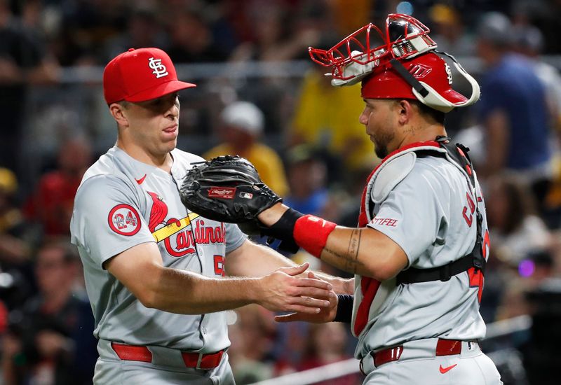 Jul 2, 2024; Pittsburgh, Pennsylvania, USA;  St. Louis Cardinals relief pitcher Ryan Helsley (56) and catcher Willson Contreras (40) celebrate after defeating the Pittsburgh Pirates at PNC Park. St. Louis won 7-4. Mandatory Credit: Charles LeClaire-USA TODAY Sports