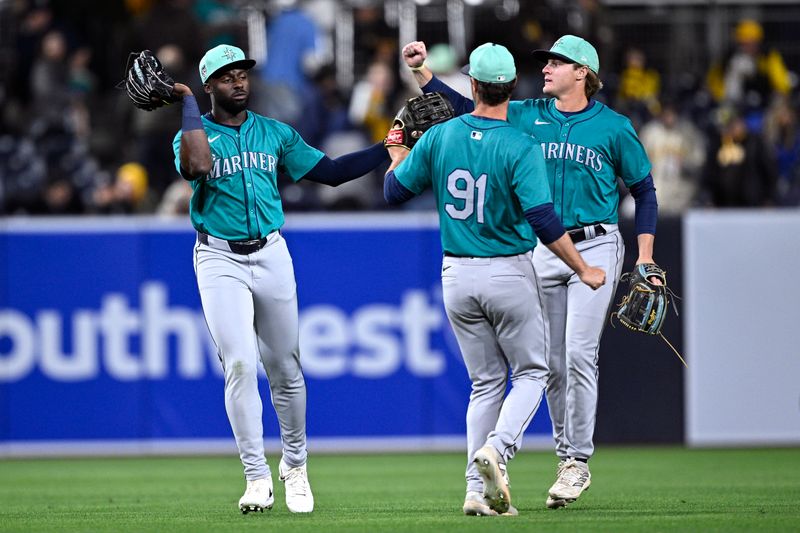 Mar 25, 2024; San Diego, California, USA; Seattle Mariners players celebrate on the field after defeating the San Diego Padres at Petco Park. Mandatory Credit: Orlando Ramirez-USA TODAY Sports