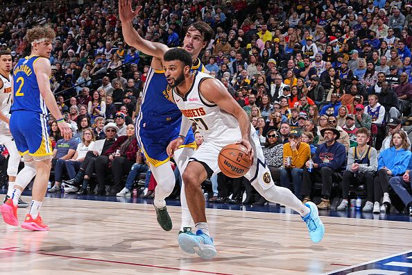 DENVER, CO - DECEMBER 25: Jamal Murray #27 of the Denver Nuggets dribbles the ball during the game against the Golden State Warriors on December 25, 2023 at the Ball Arena in Denver, Colorado. NOTE TO USER: User expressly acknowledges and agrees that, by downloading and/or using this Photograph, user is consenting to the terms and conditions of the Getty Images License Agreement. Mandatory Copyright Notice: Copyright 2023 NBAE (Photo by Garrett Ellwood/NBAE via Getty Images)