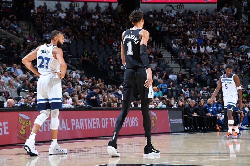 SAN ANTONIO, TX - NOVEMBER 2: Rudy Gobert #27 of the Minnesota Timberwolves and Victor Wembanyama #1 of the San Antonio Spurs look on during the game on November 2, 2024 at the Frost Bank Center in San Antonio, Texas. NOTE TO USER: User expressly acknowledges and agrees that, by downloading and or using this photograph, user is consenting to the terms and conditions of the Getty Images License Agreement. Mandatory Copyright Notice: Copyright 2024 NBAE (Photos by Michael Gonzales/NBAE via Getty Images)