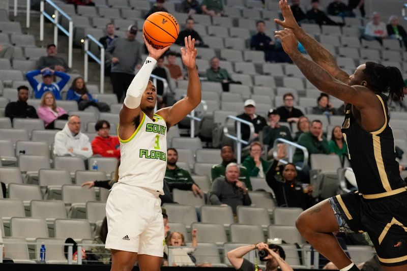 Mar 16, 2024; Fort Worth, TX, USA;  South Florida Bulls guard Chris Youngblood (3) attempts a three point basket against UAB Blazers guard Alejandro Vasquez (10) during the first half at Dickies Arena. Mandatory Credit: Chris Jones-USA TODAY Sports