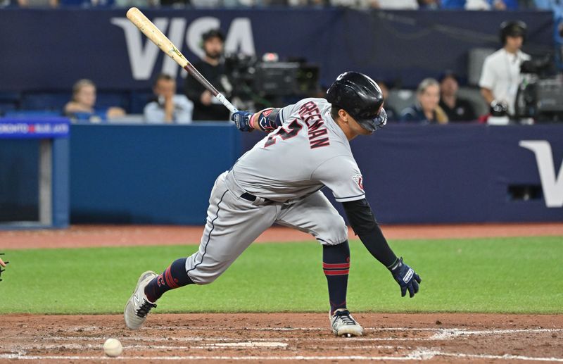 Aug 26, 2023; Toronto, Ontario, CAN;  Cleveland Guardians third baseman Tyler Freeman (2) strikes out swinging with the bases loaded against the Toronto Blue Jays in the sixth inning at Rogers Centre. Mandatory Credit: Dan Hamilton-USA TODAY Sports