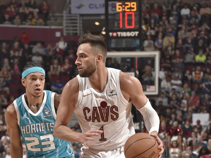 CLEVELAND, OH - APRIL 14: Max Strus #1 of the Cleveland Cavaliers dribbles the ball during the game against the Charlotte Hornets on April 14, 2024 at Rocket Mortgage FieldHouse in Cleveland, Ohio. NOTE TO USER: User expressly acknowledges and agrees that, by downloading and/or using this Photograph, user is consenting to the terms and conditions of the Getty Images License Agreement. Mandatory Copyright Notice: Copyright 2024 NBAE (Photo by David Liam Kyle/NBAE via Getty Images)