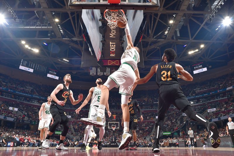 CLEVELAND, OH - MARCH 5: Kristaps Porzingis #8 of the Boston Celtics dunks the ball during the game against the Cleveland Cavaliers on March 5, 2024 at Rocket Mortgage FieldHouse in Cleveland, Ohio. NOTE TO USER: User expressly acknowledges and agrees that, by downloading and/or using this Photograph, user is consenting to the terms and conditions of the Getty Images License Agreement. Mandatory Copyright Notice: Copyright 2024 NBAE (Photo by David Liam Kyle/NBAE via Getty Images)