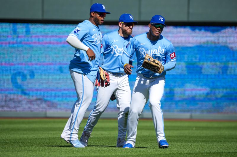 Apr 11, 2024; Kansas City, Missouri, USA; Kansas City Royals left fielder Nelson Velázquez (17), center fielder Kyle Isbel (28) and outfielder Dairon Blanco (44) celebrate in the outfield after the win over the Houston Astros at Kauffman Stadium. Mandatory Credit: Denny Medley-USA TODAY Sports