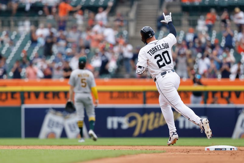 Jun 26, 2025; Detroit, Michigan, USA;  Detroit Tigers first base Spencer Torkelson (20) celebrates after he hits a home run in the first inning against the Athletics at Comerica Park. Mandatory Credit: Rick Osentoski-Imagn Images