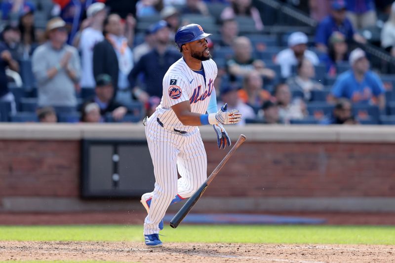Apr 23, 2025; New York City, New York, USA; New York Mets designated hitter Starling Marte (6) watches his walkoff RBI single against the Philadelphia Phillies during the tenth inning at Citi Field. Mandatory Credit: Brad Penner-Imagn Images