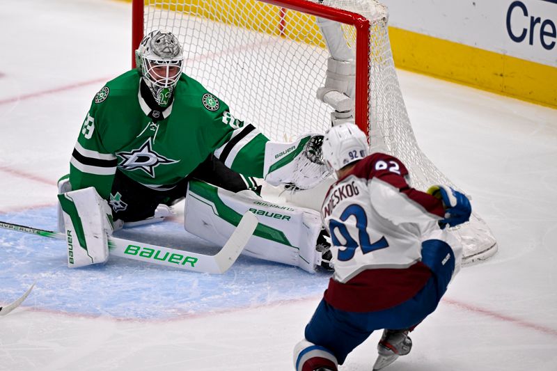 May 3, 2025; Dallas, Texas, USA; Dallas Stars goaltender Jake Oettinger (29) stops a shot by Colorado Avalanche left wing Gabriel Landeskog (92) during the first period in game seven of the first round of the 2025 Stanley Cup Playoffs at American Airlines Center. Mandatory Credit: Jerome Miron-Imagn Images
