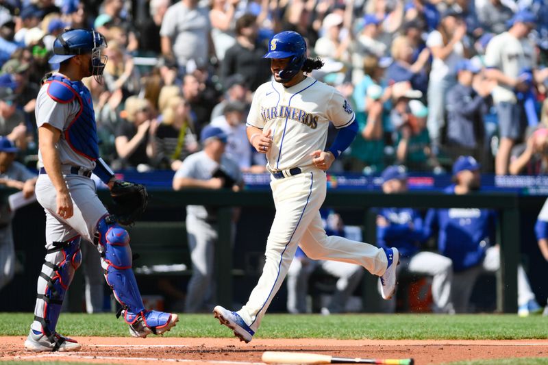 Sep 17, 2023; Seattle, Washington, USA; Seattle Mariners third baseman Eugenio Suarez (28) scores a run against the Los Angeles Dodgers during the second inning at T-Mobile Park. Mandatory Credit: Steven Bisig-USA TODAY Sports