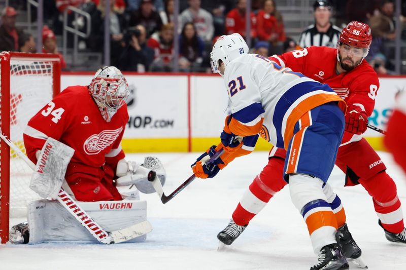 Feb 29, 2024; Detroit, Michigan, USA;  Detroit Red Wings goaltender Alex Lyon (34) makes a save on New York Islanders center Kyle Palmieri (21) in the third period at Little Caesars Arena. Mandatory Credit: Rick Osentoski-USA TODAY Sports