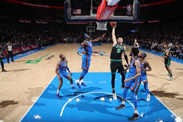 OKLAHOMA CITY, OK - JANUARY 2: Kristaps Porzingis #8 of the Boston Celtics drives to the basket during the gameagainst the Oklahoma City Thunder on January 2, 2024 at Paycom Arena in Oklahoma City, Oklahoma. NOTE TO USER: User expressly acknowledges and agrees that, by downloading and or using this photograph, User is consenting to the terms and conditions of the Getty Images License Agreement. Mandatory Copyright Notice: Copyright 2024 NBAE (Photo by Zach Beeker/NBAE via Getty Images)