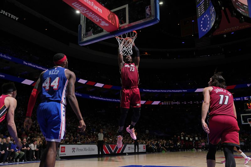 PHILADELPHIA, PA - FEBRUARY 14: Bam Adebayo #13 of the Miami Heat dunks the ball during the game against the Philadelphia 76ers on February 14, 2024 at the Wells Fargo Center in Philadelphia, Pennsylvania NOTE TO USER: User expressly acknowledges and agrees that, by downloading and/or using this Photograph, user is consenting to the terms and conditions of the Getty Images License Agreement. Mandatory Copyright Notice: Copyright 2024 NBAE (Photo by Jesse D. Garrabrant/NBAE via Getty Images)