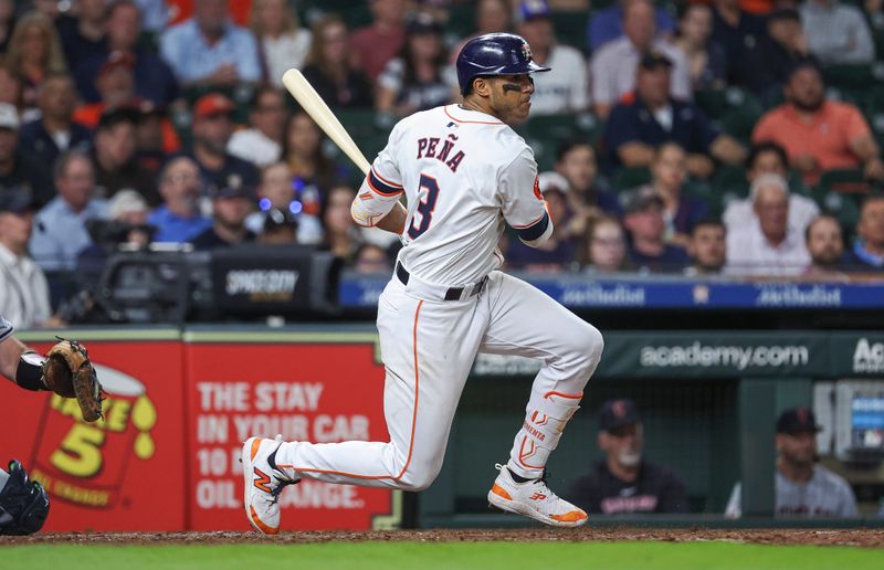 May 1, 2024; Houston, Texas, USA;  Houston Astros shortstop Jeremy Pena (3) hits a single during the ninth inning against the Cleveland Guardians at Minute Maid Park. Mandatory Credit: Troy Taormina-USA TODAY Sports