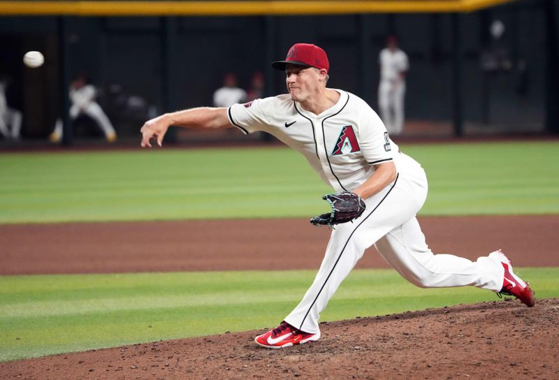 Jul 26, 2024; Phoenix, Arizona, USA; Arizona Diamondbacks pitcher Paul Sewald (38) pitches against the Pittsburgh Pirates during the ninth inning at Chase Field. Mandatory Credit: Joe Camporeale-USA TODAY Sports