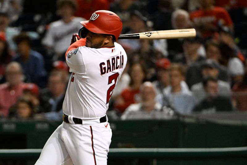 Apr 4, 2023; Washington, District of Columbia, USA; Washington Nationals second baseman Luis Garcia (2) hits an RBI double against the Tampa Bay Rays during the seventh inning at Nationals Park. Mandatory Credit: Brad Mills-USA TODAY Sports