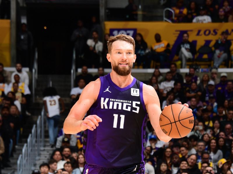 LOS ANGELES, CA - OCTOBER 26: Domantas Sabonis #11 of the Sacramento Kings dribbles the ball during the game against the Los Angeles Lakers on October 26, 2024 at Crypto.Com Arena in Los Angeles, California. NOTE TO USER: User expressly acknowledges and agrees that, by downloading and/or using this Photograph, user is consenting to the terms and conditions of the Getty Images License Agreement. Mandatory Copyright Notice: Copyright 2024 NBAE (Photo by Adam Pantozzi/NBAE via Getty Images)