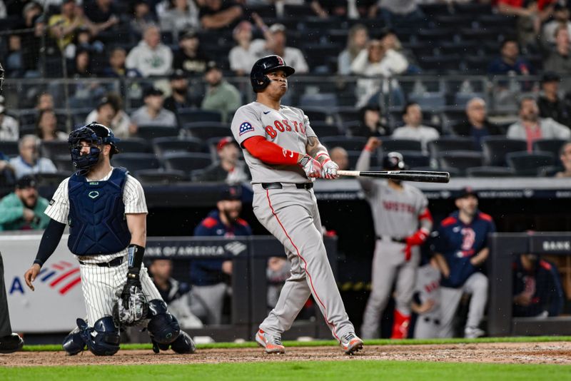 Jun 8, 2025; Bronx, New York, USA; Boston Red Sox designated hitter Rafael Devers (11) reacts after hitting a solo home run against the New York Yankees during the ninth inning at Yankee Stadium. Mandatory Credit: John Jones-Imagn Images