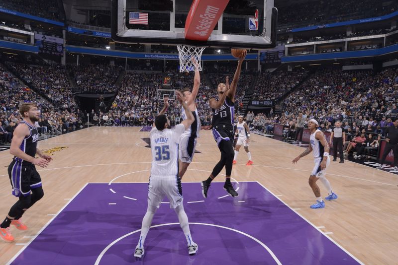 SACRAMENTO, CA - JANUARY 3: Keegan Murray #13 of the Sacramento Kings drives to the basket during the game against the Orlando Magic on January 3, 2024 at Golden 1 Center in Sacramento, California. NOTE TO USER: User expressly acknowledges and agrees that, by downloading and or using this Photograph, user is consenting to the terms and conditions of the Getty Images License Agreement. Mandatory Copyright Notice: Copyright 2024 NBAE (Photo by Rocky Widner/NBAE via Getty Images)