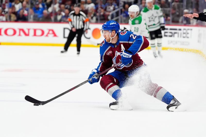 May 1, 2025; Denver, Colorado, USA; Colorado Avalanche center Nathan MacKinnon (29) controls the puck in the second period against the Dallas Stars in game six of the first round of the 2025 Stanley Cup Playoffs at Ball Arena. Mandatory Credit: Ron Chenoy-Imagn Images