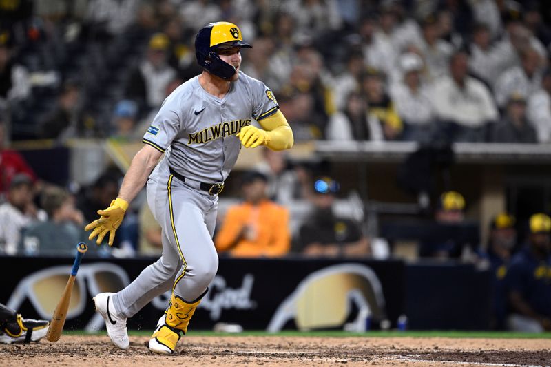 Jun 20, 2024; San Diego, California, USA; Milwaukee Brewers first baseman Jake Bauers (9) hits a single against the San Diego Padres during the ninth inning at Petco Park. Mandatory Credit: Orlando Ramirez-USA TODAY Sports