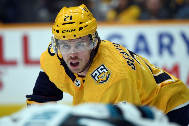 Mar 19, 2024; Nashville, Tennessee, USA; Nashville Predators left wing Anthony Beauvillier (21) waits for a face off during the first period against the San Jose Sharks at Bridgestone Arena. Mandatory Credit: Christopher Hanewinckel-USA TODAY Sports