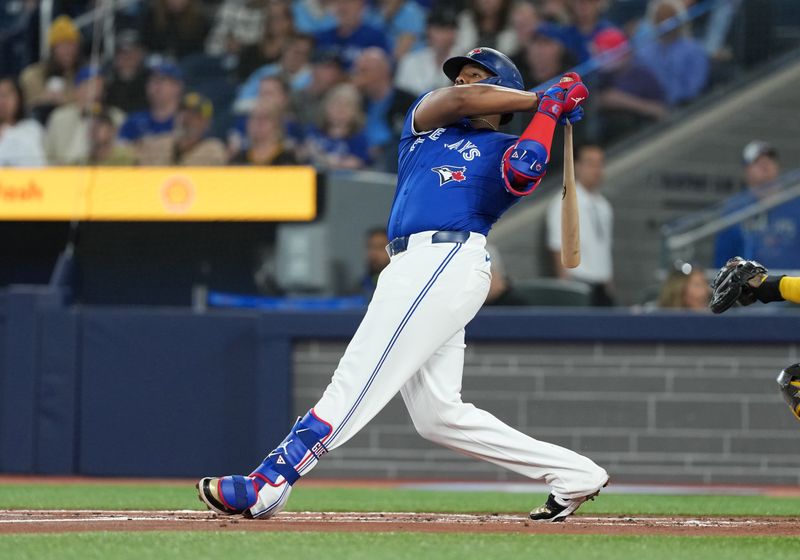 May 20, 2025; Toronto, Ontario, CAN; Toronto Blue Jays first baseman Vladimir Guerrero Jr. (27) hits a home run against the San Diego Padres during the first inning at Rogers Centre. Mandatory Credit: Nick Turchiaro-Imagn Images
