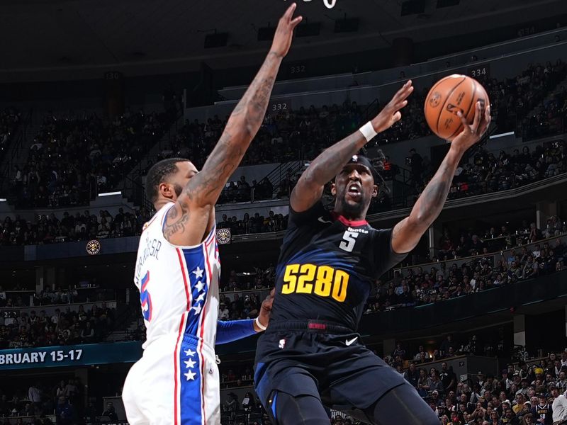 DENVER, CO - JANUARY 27: Kentavious Caldwell-Pope #5 of the Denver Nuggets drives to the basket during the game against the Philadelphia 76ers on January 27, 2024 at the Ball Arena in Denver, Colorado. NOTE TO USER: User expressly acknowledges and agrees that, by downloading and/or using this Photograph, user is consenting to the terms and conditions of the Getty Images License Agreement. Mandatory Copyright Notice: Copyright 2024 NBAE (Photo by Garrett Ellwood/NBAE via Getty Images)