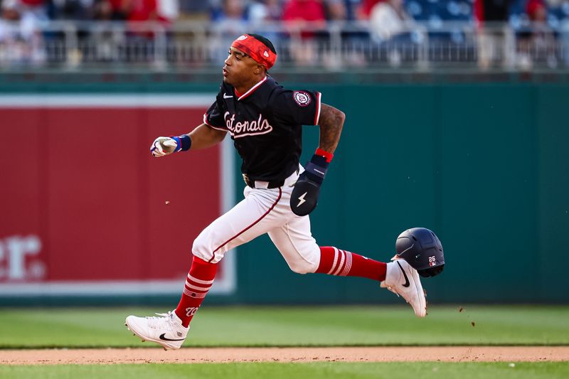 Apr 20, 2024; Washington, District of Columbia, USA; Washington Nationals shortstop Nasim Nunez (26) scores the game winning run off single by first base Joey Meneses (45) during the tenth inning against the Houston Astros at Nationals Park. Mandatory Credit: Scott Taetsch-USA TODAY Sports